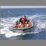 The dropped-off boomnetter are picked out from the sea and delivered back on board
