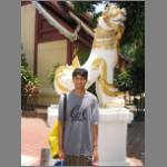 Puneet with a mythical lion on temple grounds