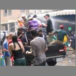 A truck being attacked by water throwers
