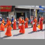 Orange robes for good luck? No, just the colors of "10 Pipers" whisky