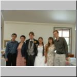 Freshly married couple with friends